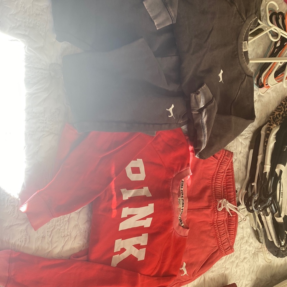 Two Pink sweat suits Black large top medium pants red small top medium pants